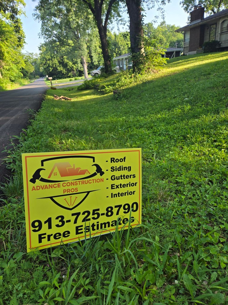 Advance Construction Pros yard sign listing roofing, siding, gutters, exterior and interior work
