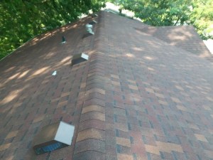 Hail damage marked with chalk during a roof inspection in Kansas City, KS